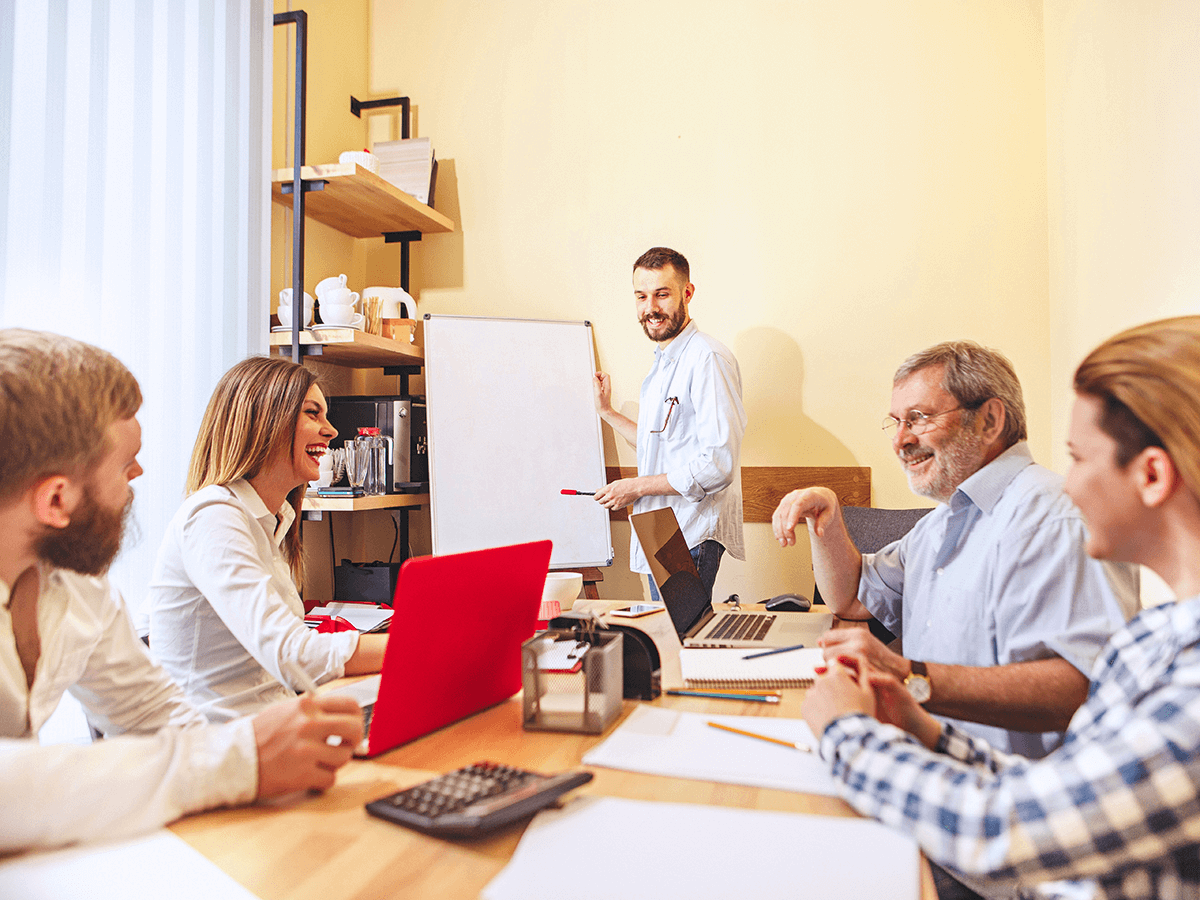 Employees discussing practical skills training for company