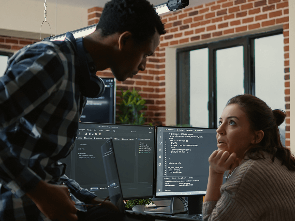 Software engineer discussing roles with data engineer.